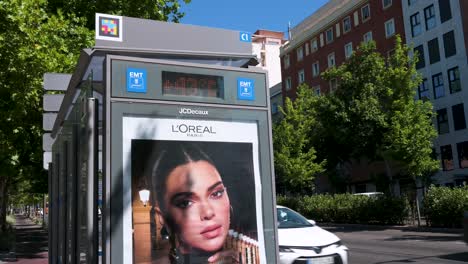 bus stop with l'oréal advertisement featuring kendall jenner in an urban setting