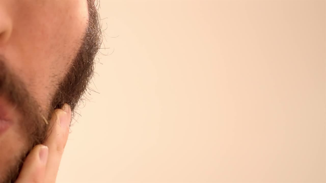 Morning Routine: Detailed Shot of Man Shaving Face