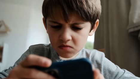 upset child using smartphone