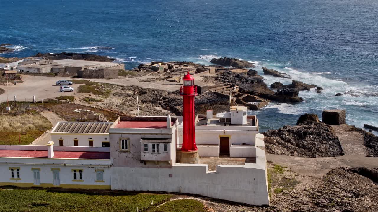Aerial view of red lighthouse near coastal area in Portugal