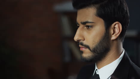 Close-Up-View-Of-Arabian-Businessman-Wearing-Suit-And-Tie-Scrolling-And-Typing-With-His-Finger-In-The-Air-Like-Having-A-Hologram-Screen-At-The-Office