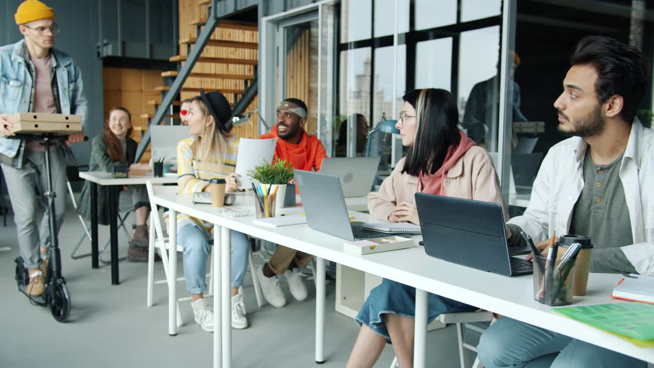 Team enjoying lunch in the modern office