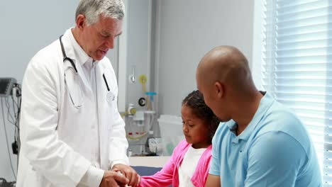 male doctor examining patient