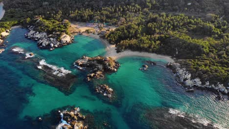 Aerial-view-of-rocky-shore-and-beaches-of-San-Juan-in-Tayrona,-Colombia---orbit,-drone-shot