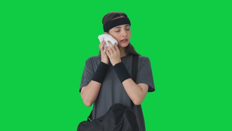 Indian-girl-taking-out-towel-from-duffel-bag-Green-screen