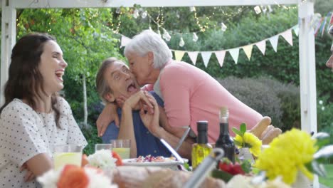 family eating outside together in summer