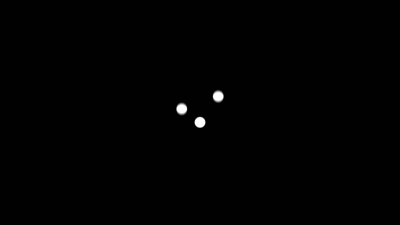 Three white dots on a black background