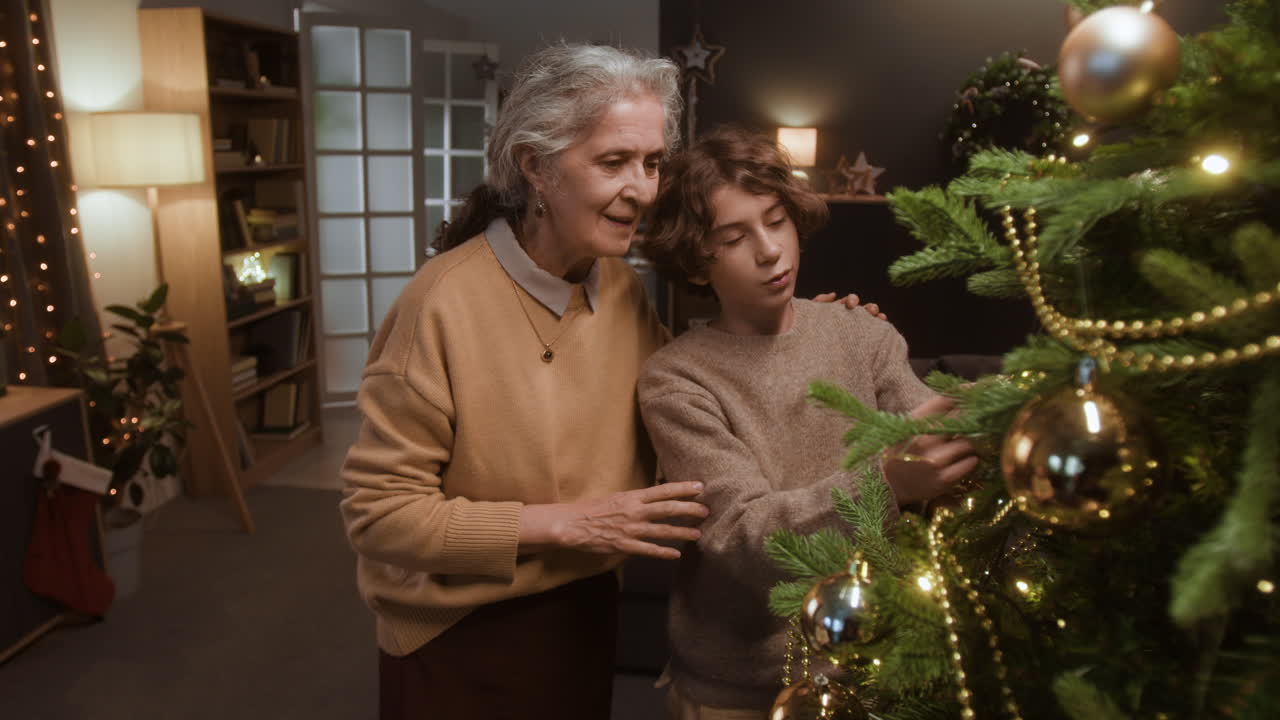 Grandmother and Grandson Decorating Christmas Tree