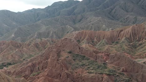 aerial shot of the red rock formations in fairytale canyon, skazka, kyrgyzstan.