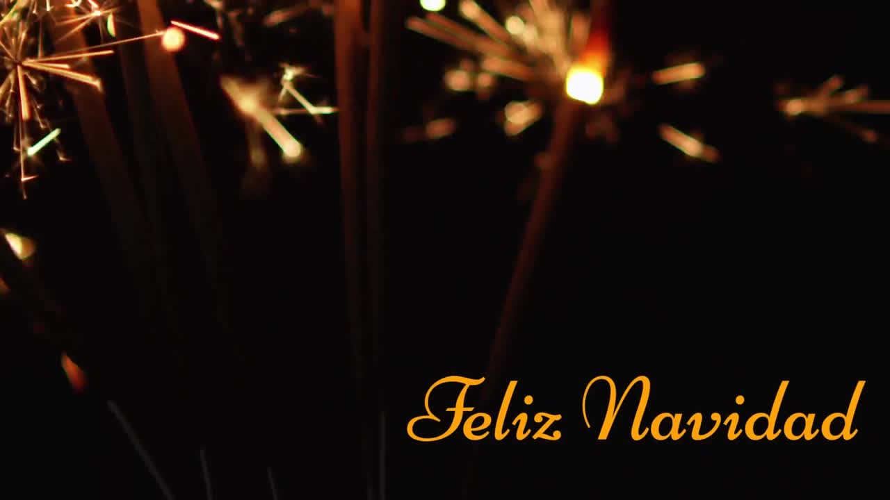 animación de texto de feliz navidad sobre chispas