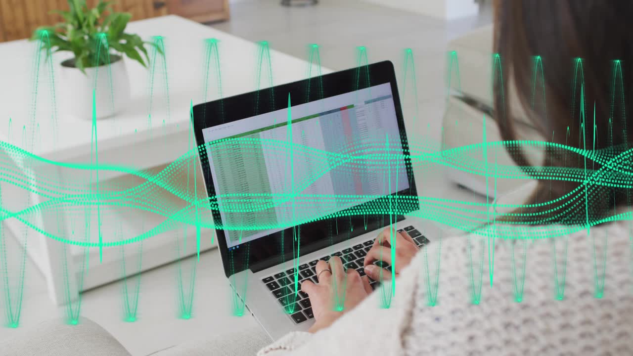 Mid-adult woman placing hands, typing spreadsheet for finance, green waveform crossing laptop