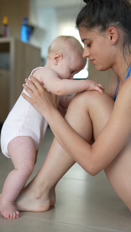 mother and baby learning to walk