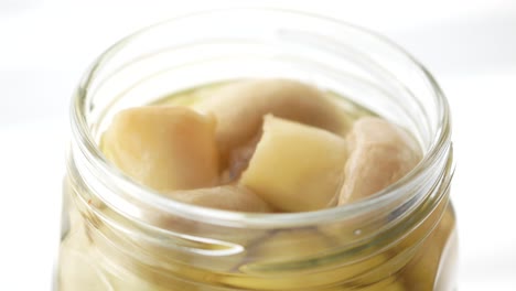 canned mushrooms in a glass jar