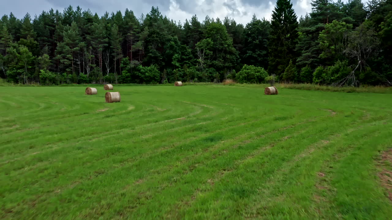 Close-up Aerial View of Bale of Straw on a Field in Saaremaa Estonia, Eastern Europe - Dolly Shot