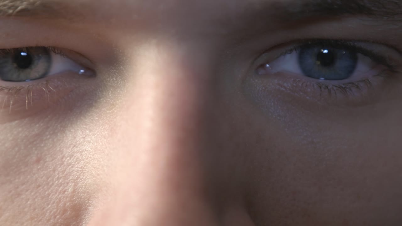 Closeup View Of A Guy's Eyes Closing Slowly - Static Shot