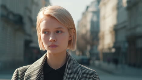 young woman with blonde hair on a city street