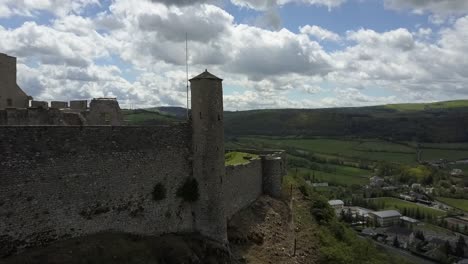 Aerial-view-of-the-castle-ruins-of-chateau-de-severac-in-Aveyron,-France,-Europe