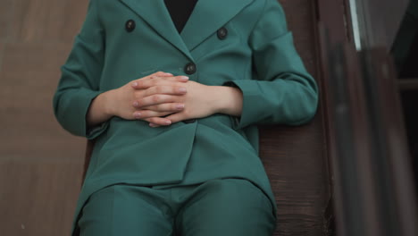 elegant woman in a green suit