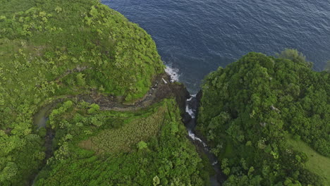 maui hawaii aerial v35 birds eye view flyover nailiilihaele and kailua streams, water flow and cascade from rocky cliffs into the ocean, amidst lush vegetation - shot with mavic 3 cine - december 2022