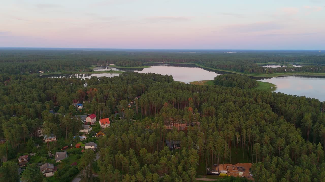 Aerial Sunset View Over Dzirnezers Lake in Carnikava, Latvia Gauja Village, Siguļi, Krievu Island and Distant Baltic Sea Horizon in Scenic Natural Landscape Captured by Drone