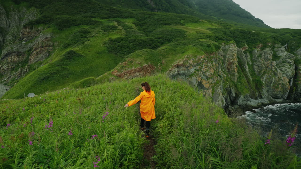 Woman Hiking on a Coastal Mountain Trail