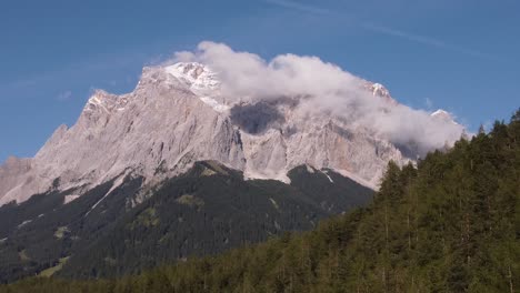 establishing shot of germanys highest mountain the matterhorn in the alps filmed from austria in a steady position by a drone