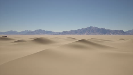 desert landscape with mountain range in the distance