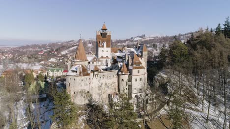 orbit around bran castle in brasov, romania on a sunny winter afternoon