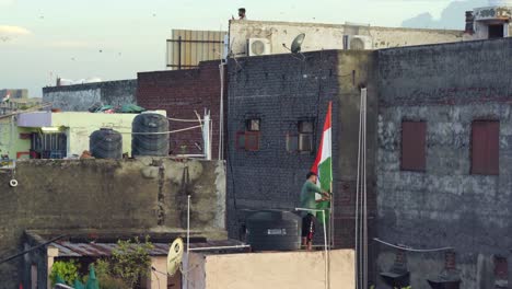 indian man fixing indian flag