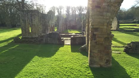 basingwerk abbey landmark medieval abandoned welsh ruins aerial view slow low push in