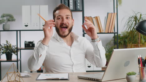 excited amazed young business man showing hands brain head explosion gesture wow brainstorm idea