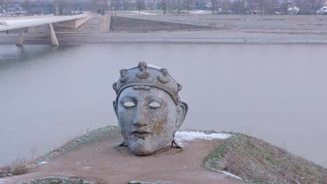 Drone-shot-tilt-and-reveal-shot-upwards-of-the-roman-helmet-mask-Nijmegen