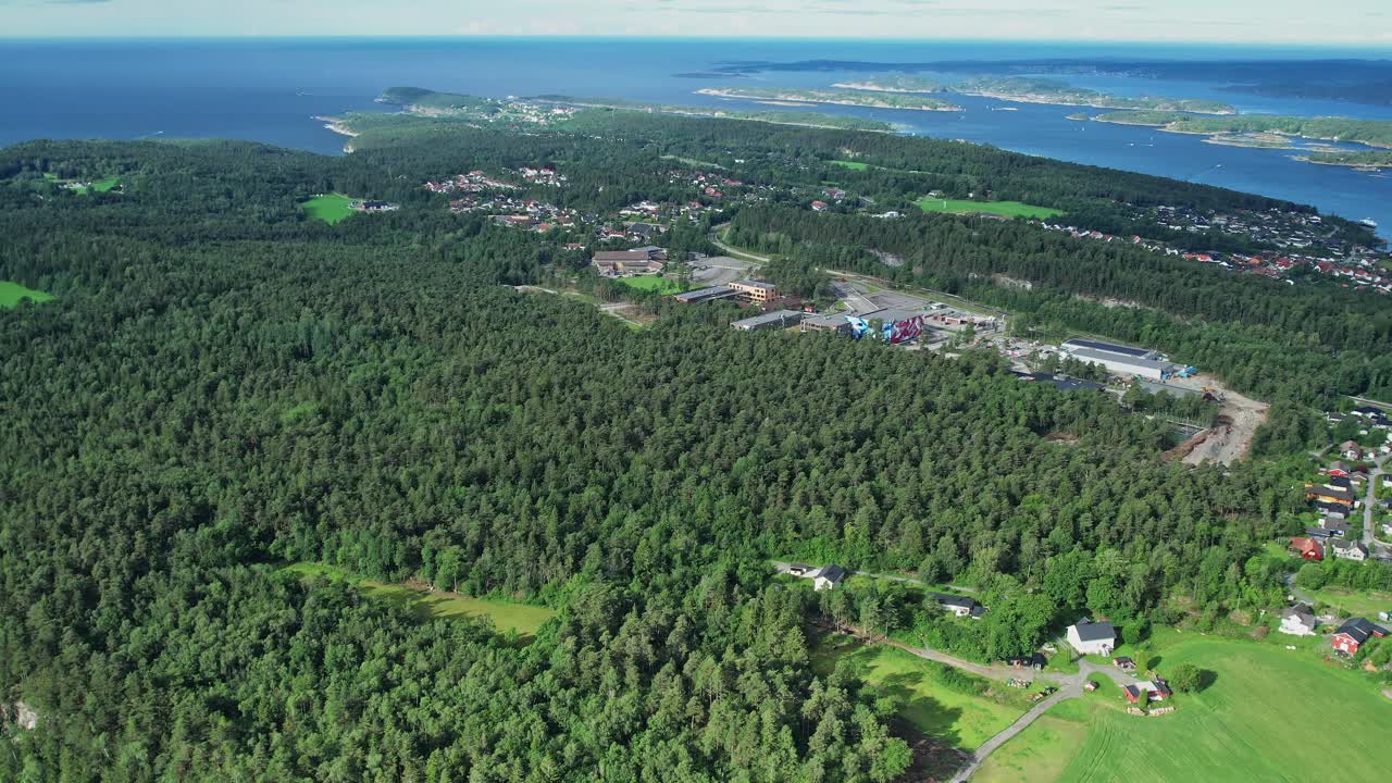 Drone view showcasing lush forests and coastal landscapes in Norway