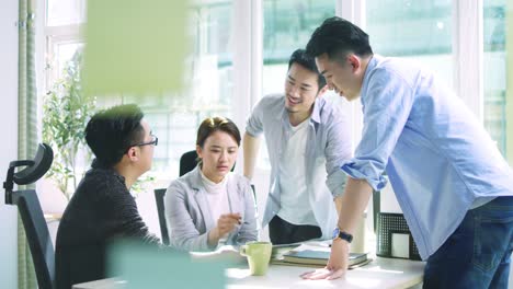 asian business men and woman meeting in office