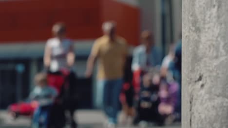 street light post against blurred people