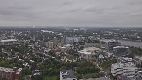 Trenton-New-Jersey-Aerial-v4-drone-flyover-captures-downtown-cityscape,-traffic-crossing-Delaware-river-and-landscape-views-of-Morrisville-on-a-gloomy-day---Shot-with-Mavic-3-Pro-Cine---September-2023