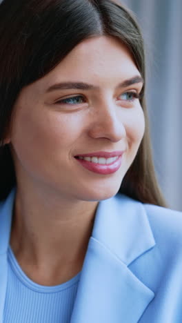 smiling woman in blue blazer