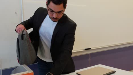 modern male educator preparing lesson
