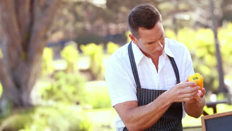 Farmer-man-tidying-up-a-table-of-local-food