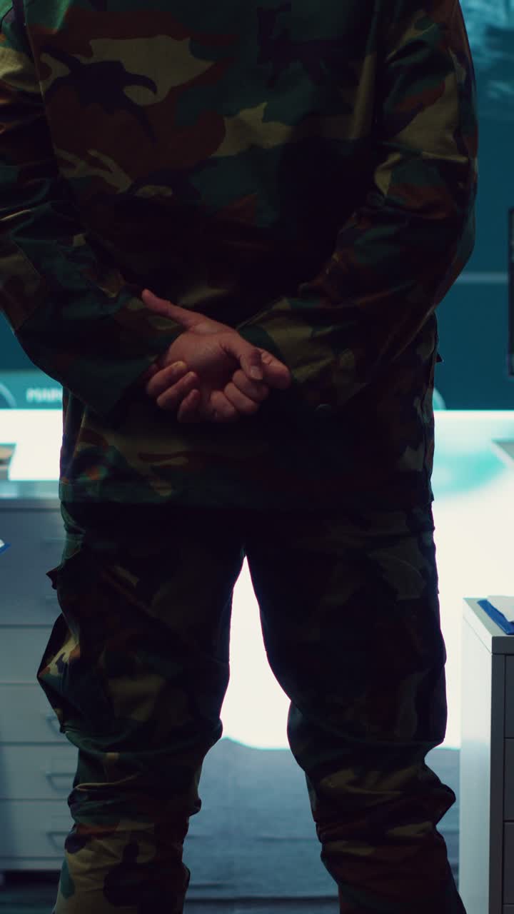 Soldier in Camouflage Uniform Watching Data on Screen