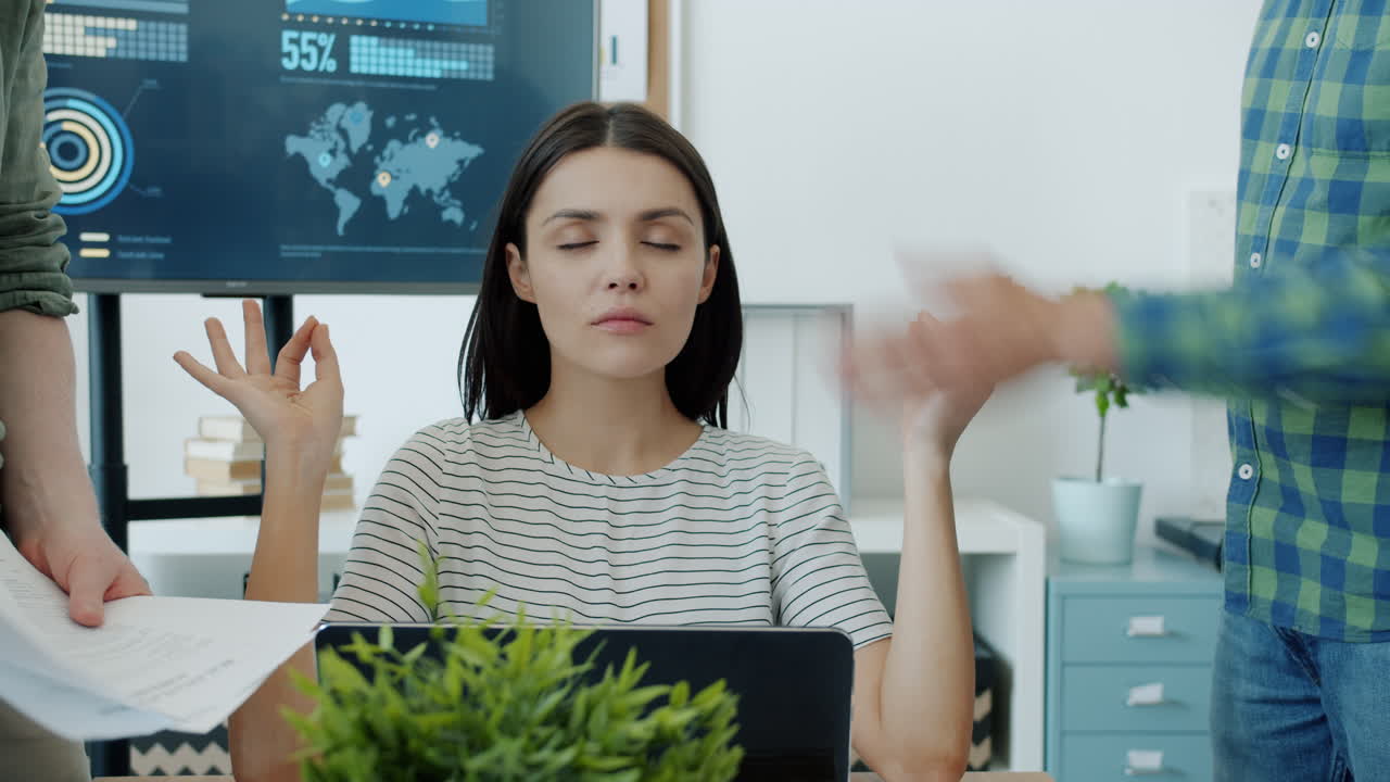 Woman Meditating During a Busy Meeting