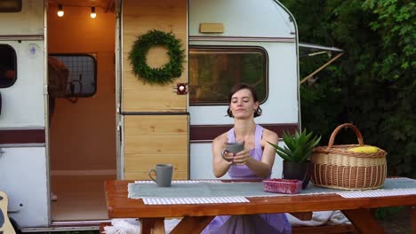 young, european couple travelling, camping,living in trailer