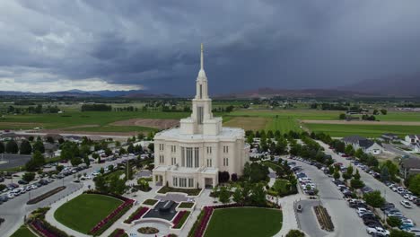 LDS-Mormon-Temple-in-Payson,-Utah-with-Stormy-Thunderstorm-Weather,-Aerial-Orbit