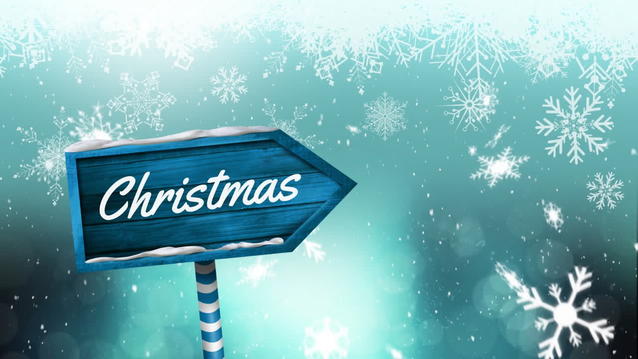 나무 표지판과 눈이 떨어지는 곳에 쓰여진 크리스마스