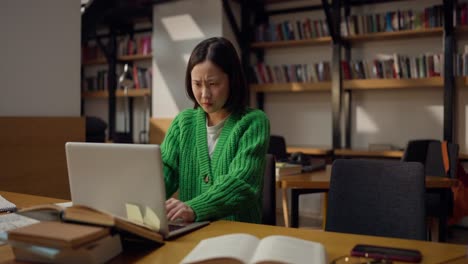 woman studying in a library