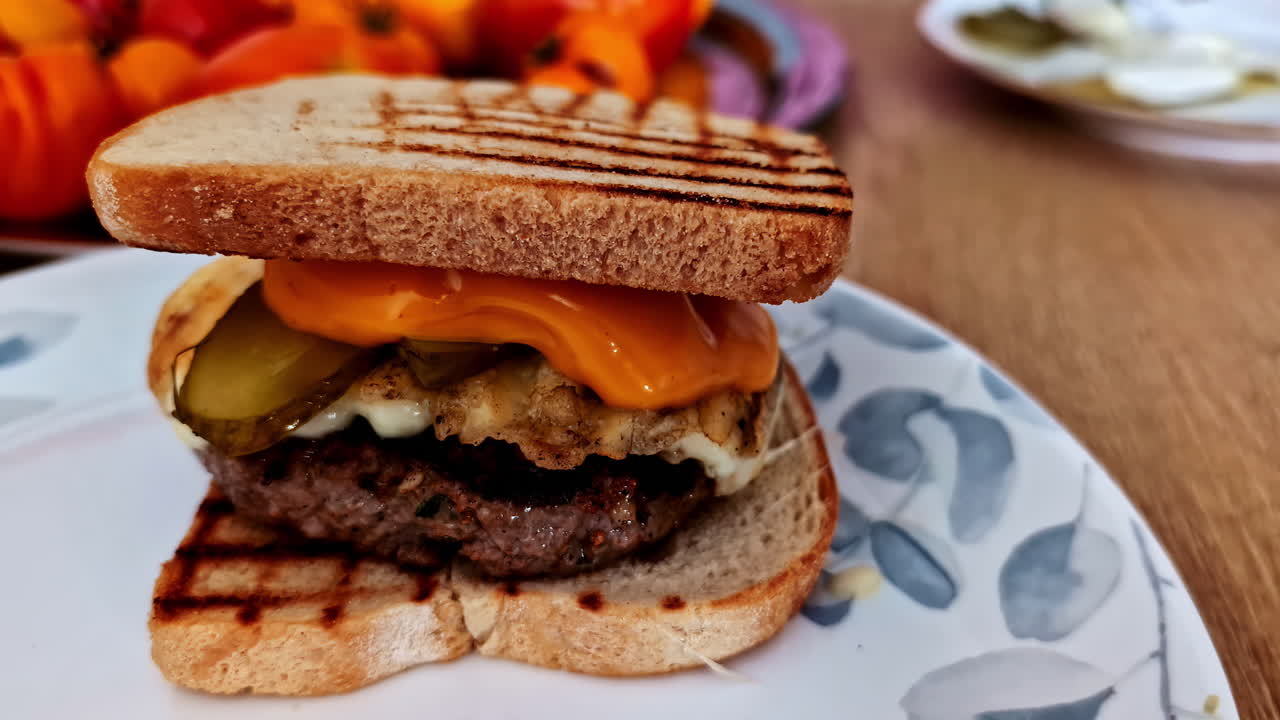Appetizing breakfast sandwich with meat portion, cheese and jalapeño pepper. Jelgava, Latvia