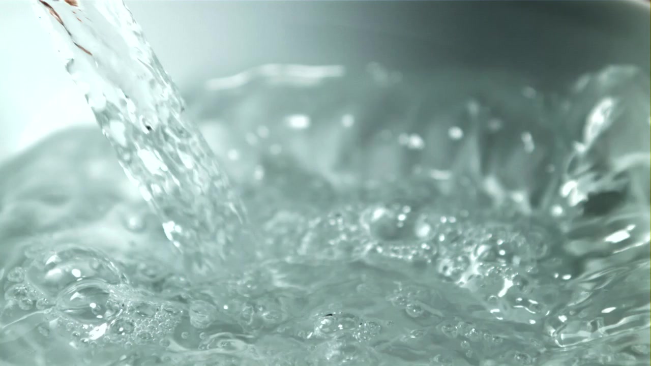 Close-up of Clear Water Pouring and Bubbling