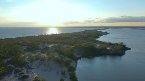 Drone-flying-down-from-up-in-the-air-to-the-sand-dunes-of-Sandbanks-peninsula