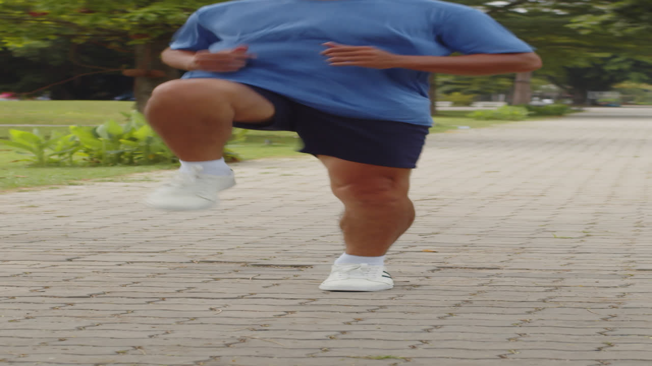 Asian Sportsman Practicing Jumping Exercise Outdoors