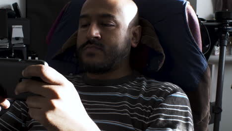 Man-sitting-on-the-chair-with-sunlight-coming-out-of-the-window